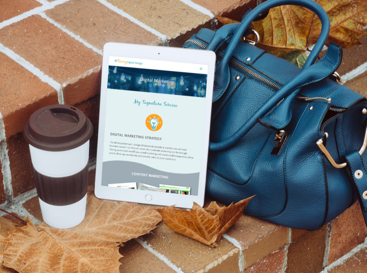 tablet with coffee and blue tote bag